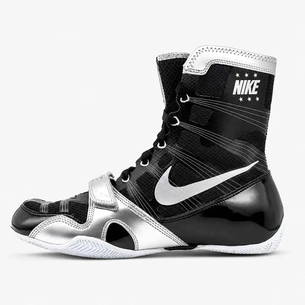 A pair of Custom Nike HyperKO boxing shoes in a black and silver colorway, featuring a forefoot lockdown strap and Nike Swoosh, displayed on a white background.