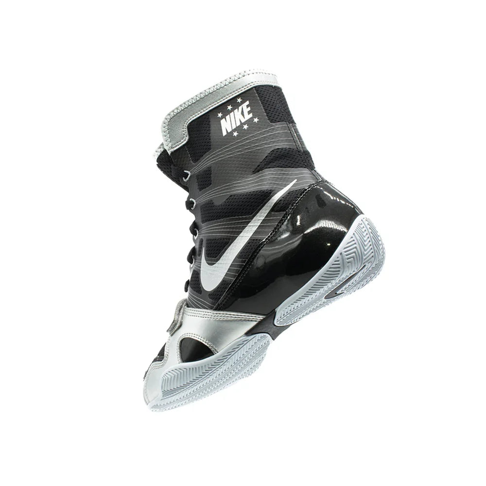 A pair of Custom Nike HyperKO boxing shoes in a black and silver colorway, featuring a forefoot lockdown strap and Nike Swoosh, displayed on a white background.
