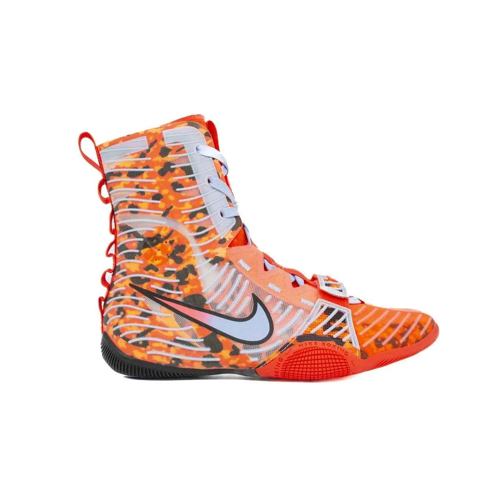 A Custom Nike HyperKO boxing shoe in a vibrant orange camo colorway, featuring a forefoot lockdown strap and a white Nike Swoosh, displayed on a white background.