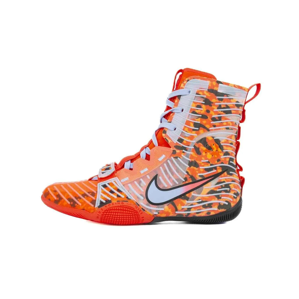 A Custom Nike HyperKO boxing shoe in a vibrant orange camo colorway, featuring a forefoot lockdown strap and a white Nike Swoosh, displayed on a white background.