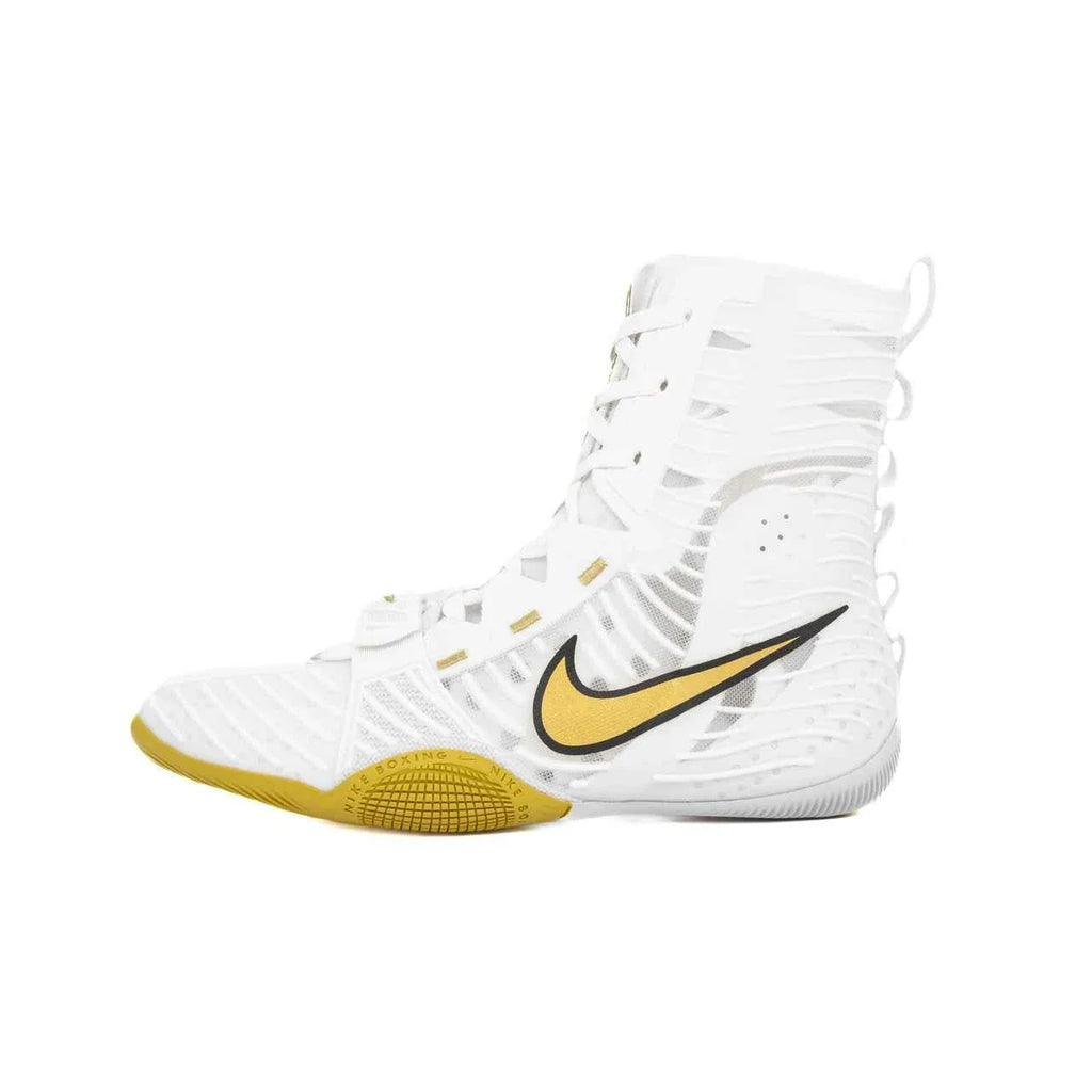 A pair of Custom Nike HyperKO boxing shoes in a crisp white and gold colorway, featuring a white forefoot lockdown strap, a gold sole, and a gold-outlined Nike Swoosh, displayed on a white background.