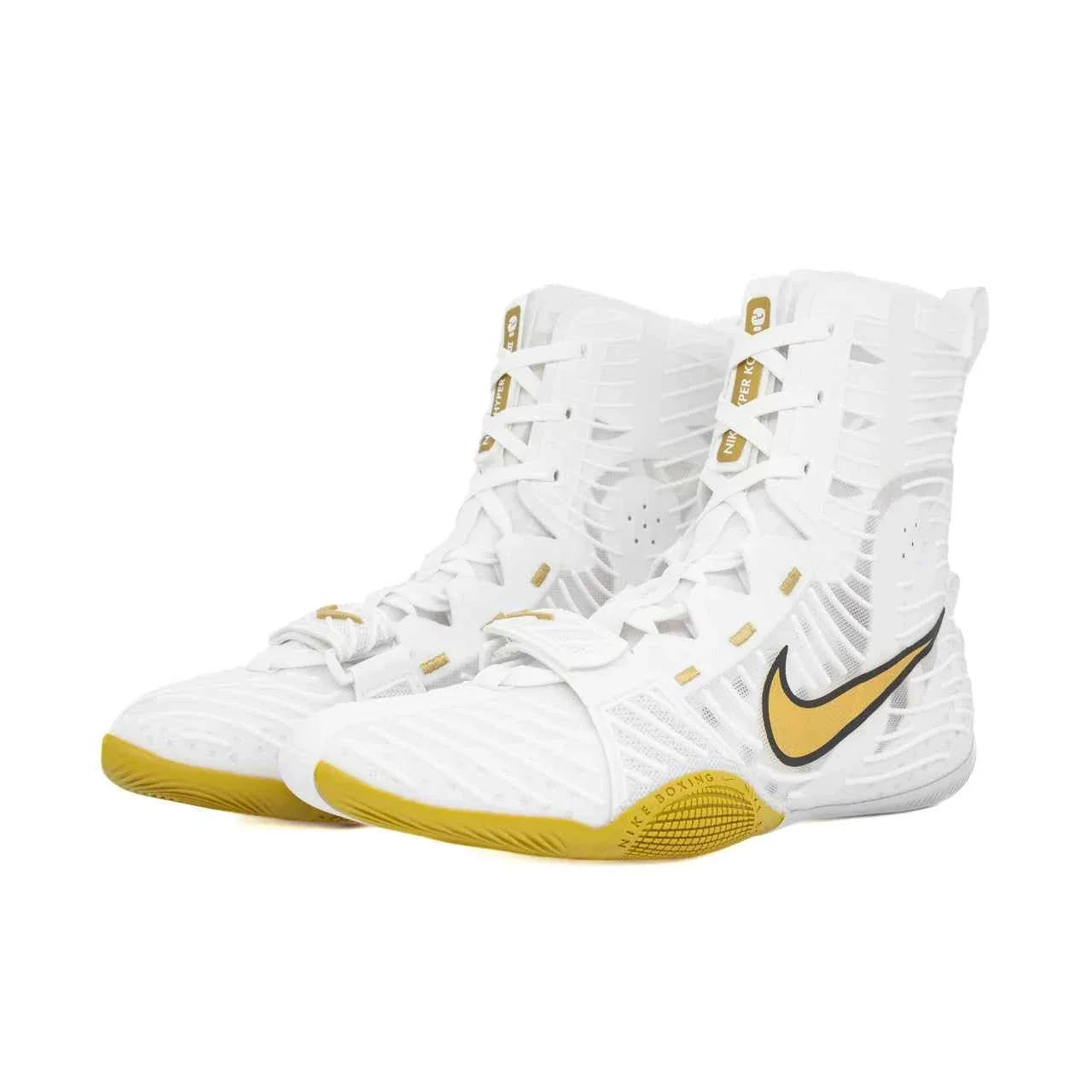 A pair of Custom Nike HyperKO boxing shoes in a crisp white and gold colorway, featuring a white forefoot lockdown strap, a gold sole, and a gold-outlined Nike Swoosh, displayed on a white background.