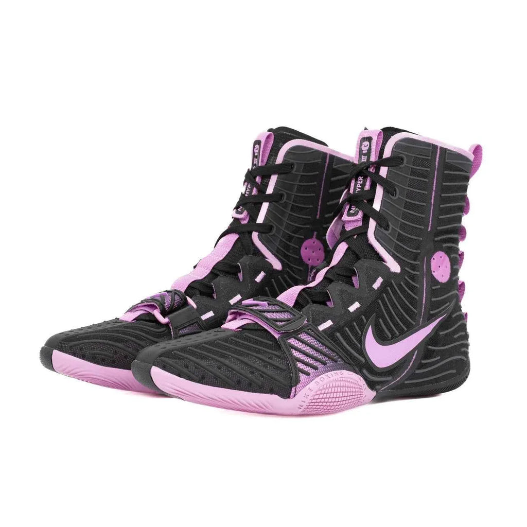 A pair of Custom Nike HyperKO boxing shoes in a black and pink colorway, featuring a pink forefoot lockdown strap and a pink Nike Swoosh, displayed on a white background.